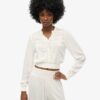 Blouse smockée à manches longues et bordures en dentelle Blouse smockée à manches longues et bordures en dentelle