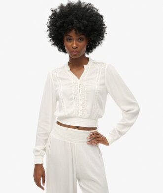Blouse smockée à manches longues et bordures en dentelle