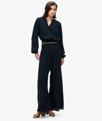 Blouse smockée à manches longues et bordures en dentelle