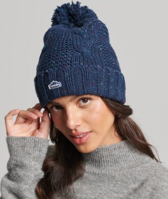Bonnet à pompon en maille torsadée