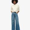 Jeans évasé à jambes larges et ourlet brut Jeans évasé à jambes larges et ourlet brut
