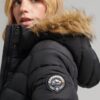 Manteau matelassé long à capuche en fausse fourrure Manteau matelassé long à capuche en fausse fourrure